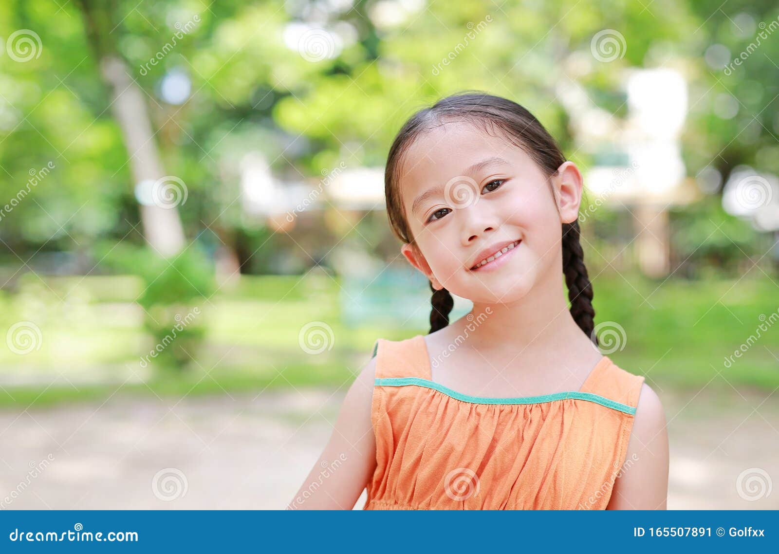 Portrait of Happy Little Asian Child in Green Garden with Looking at ...