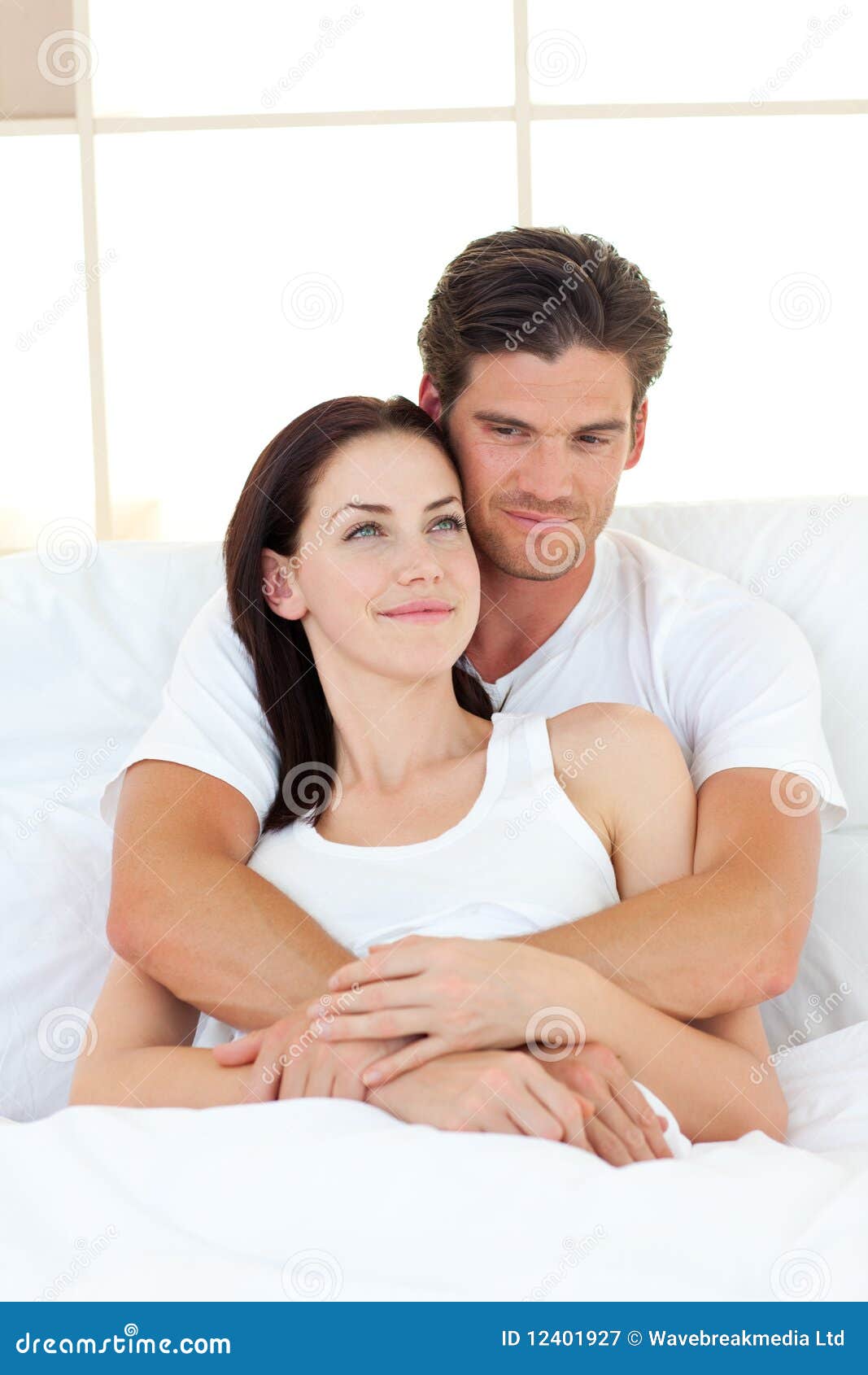 Portrait Of Happy Lovers Hugging In Their Bed Stock Image