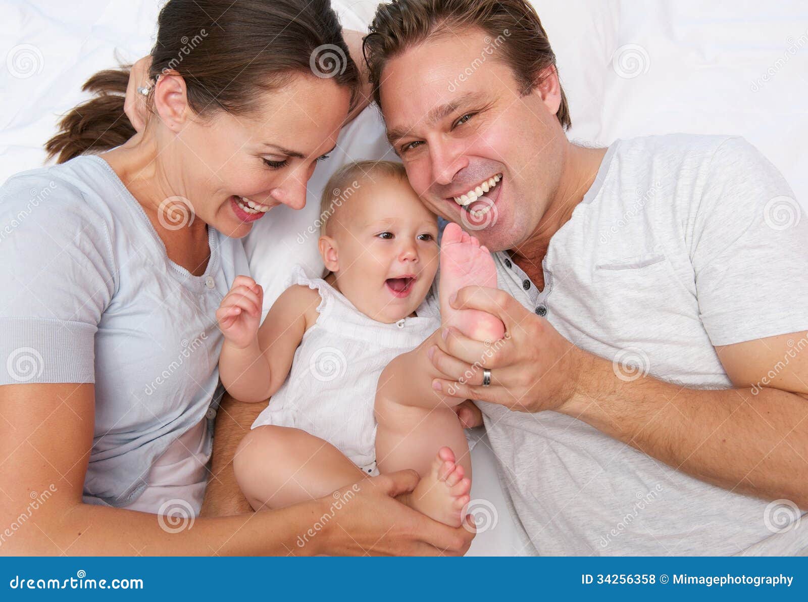 Portrait of a Happy Loving Family Playing with Baby Stock Photo ...