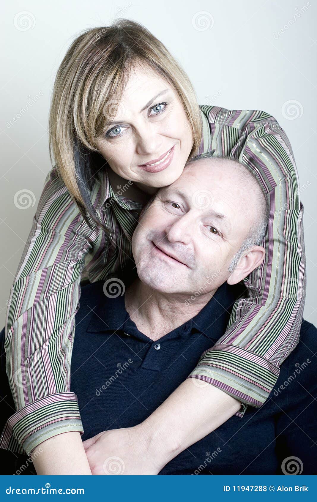 portrait of happy middle age couple smiling
