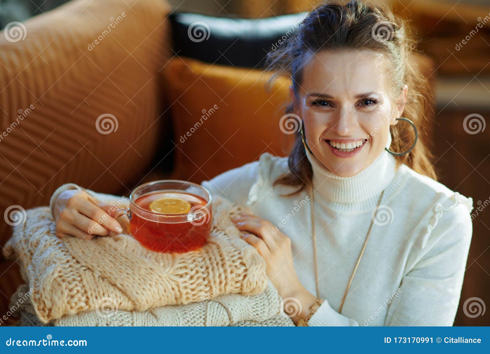 Woman with Sweaters and Tea at Modern Home in Sunny Winter Day Stock ...