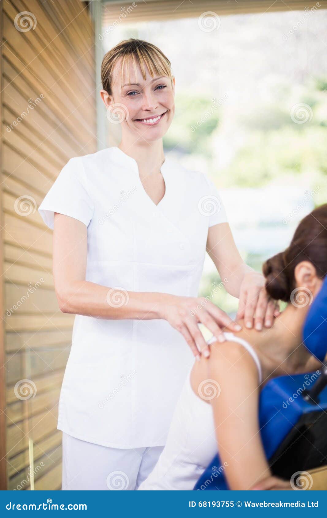 Portrait Of Happy Physiotherapist Giving Shoulder Massage Stock Image Image Of Focus