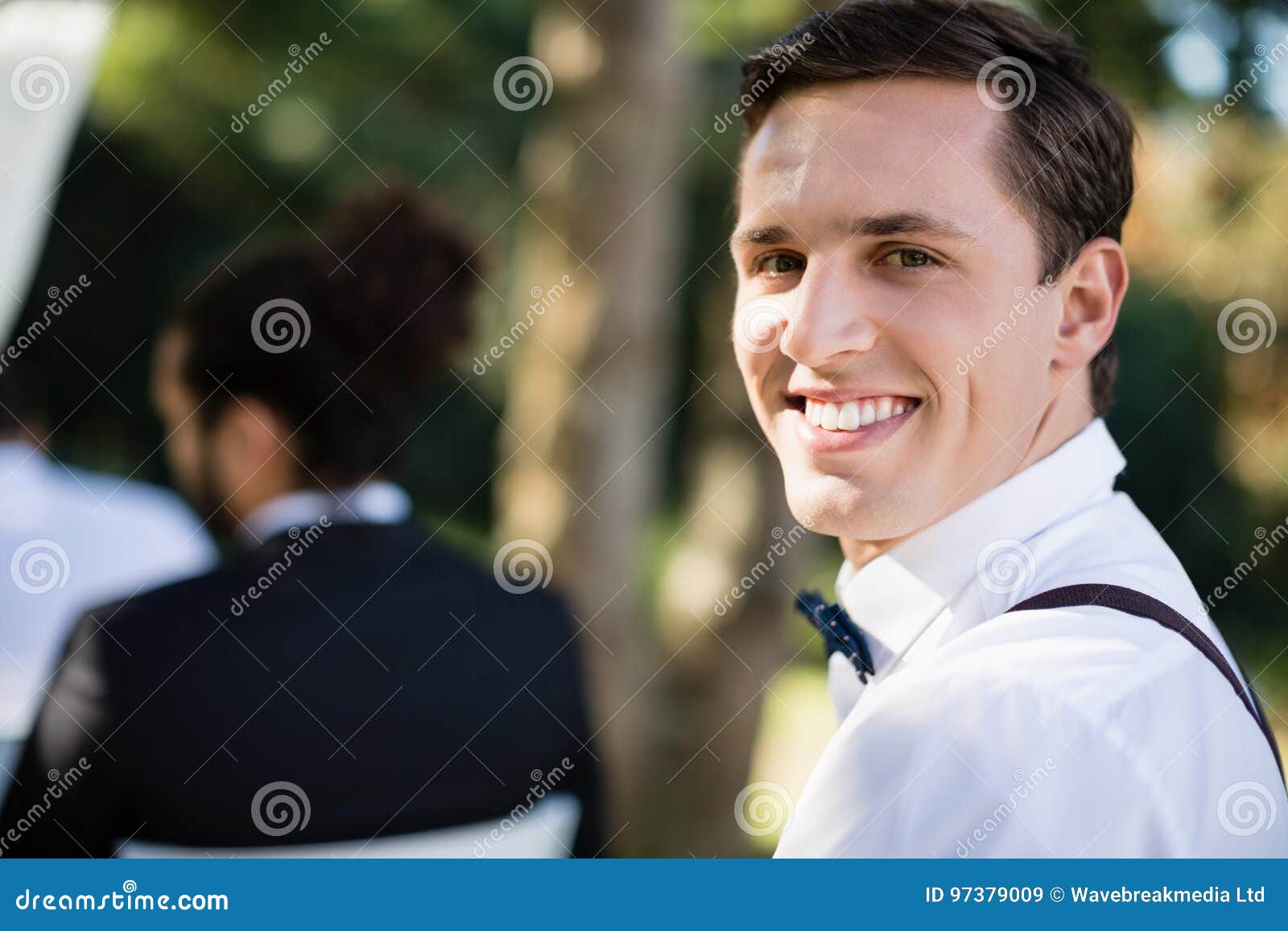Happy Waiter Carrying Serving Tray With Champagne Flutes RoyaltyFree