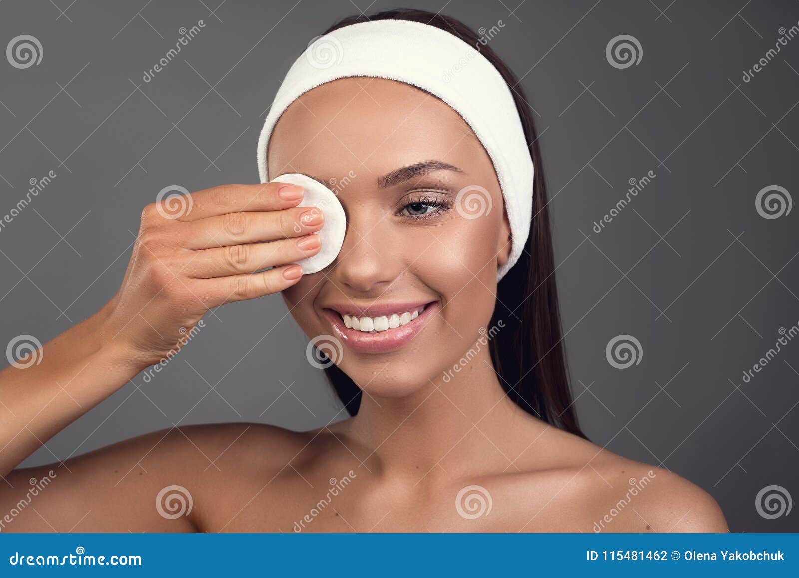 well cared girl using makeup remover