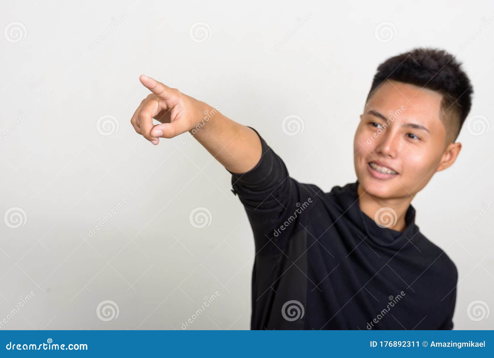 Portrait Of Happy Young Asian Lesbian Woman Pointing Finger St