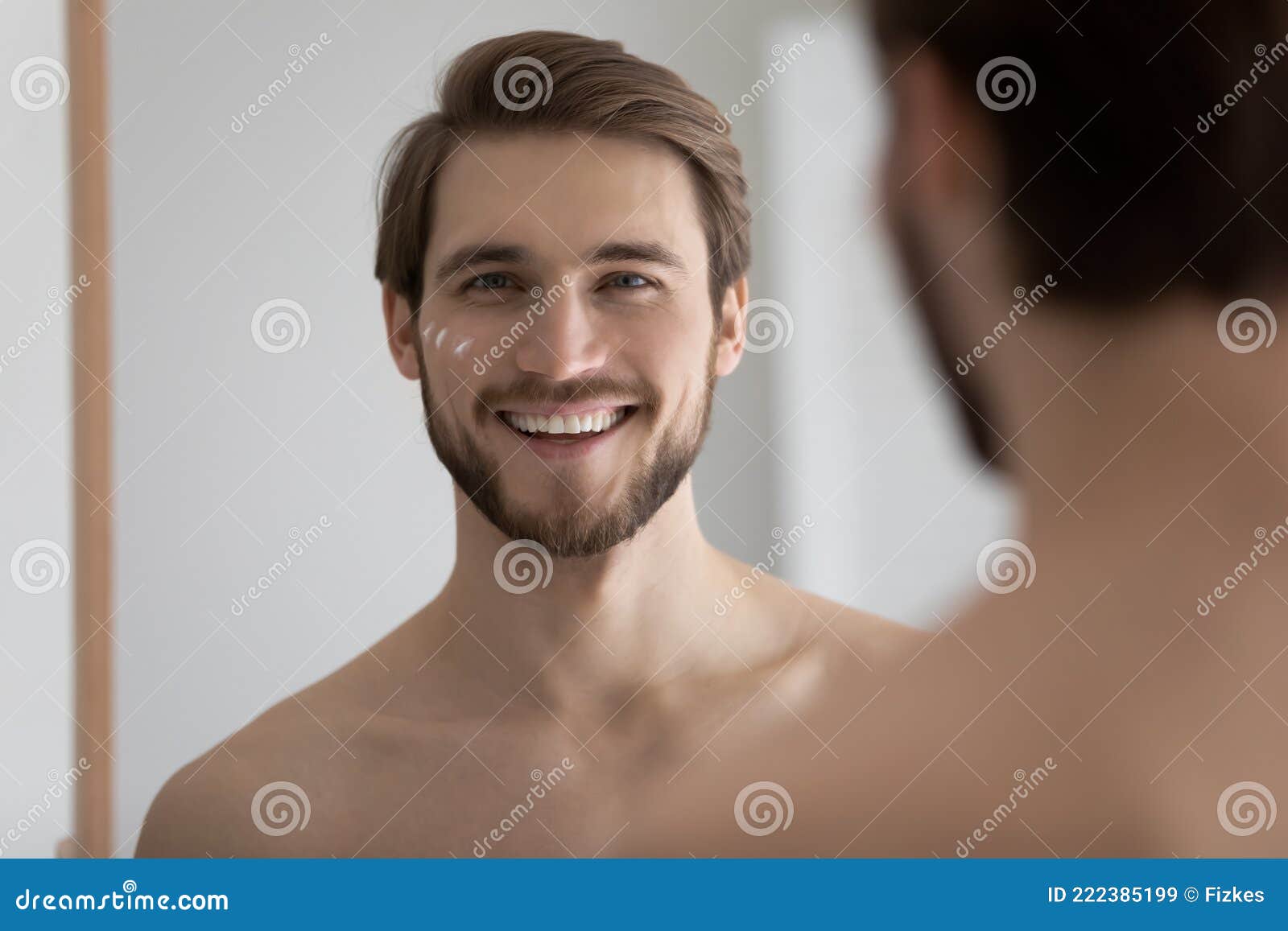 portrait of happy young bearded attractive metrosexual man