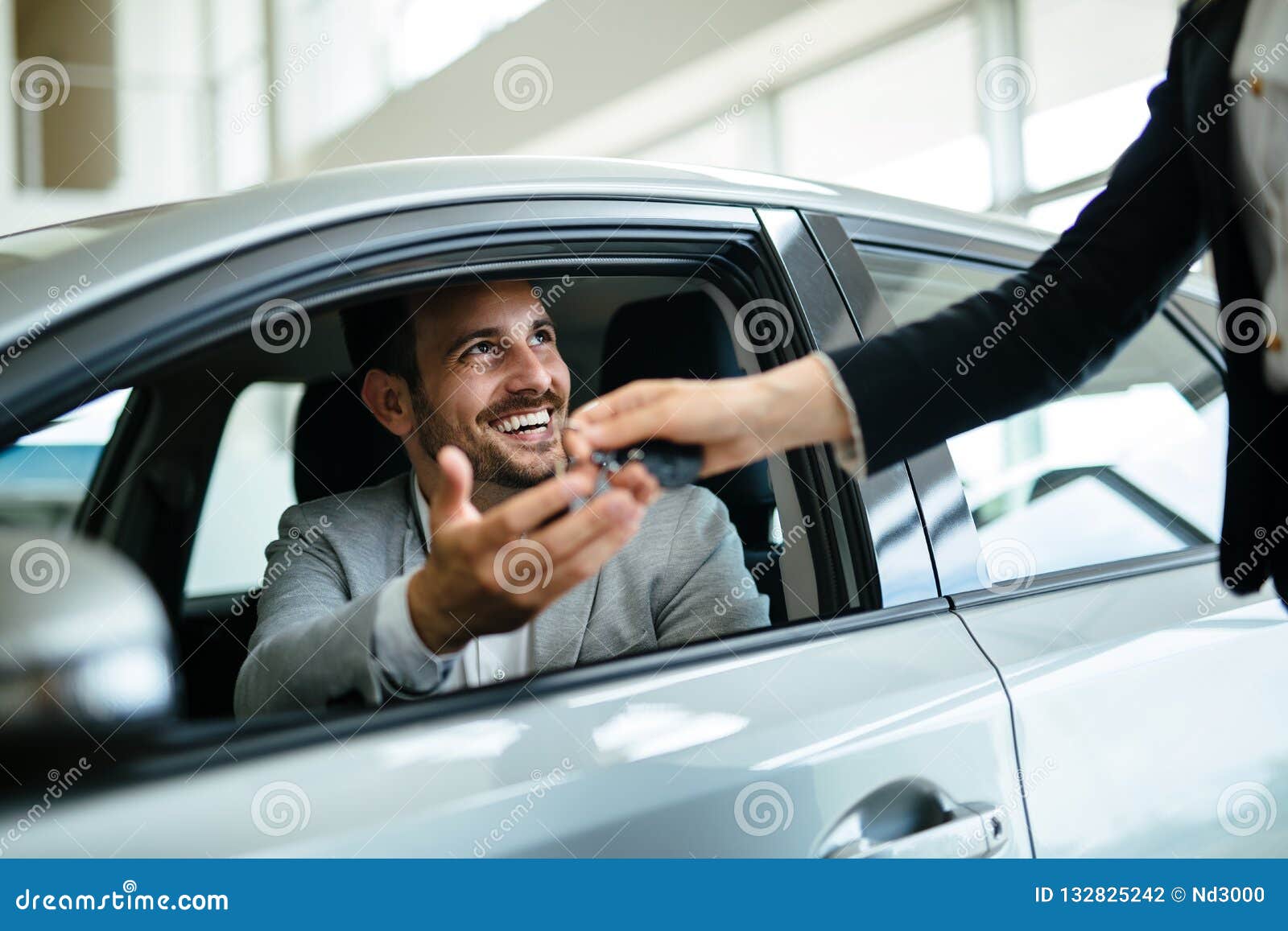 portrait of happy customer buying new car