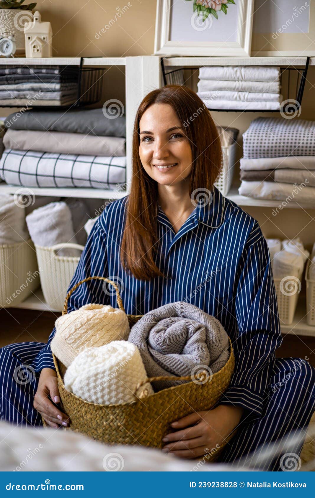 https://thumbs.dreamstime.com/z/portrait-happy-young-domestic-woman-pajamas-posing-straw-basket-linens-storage-use-marie-kondo-method-smiling-239238828.jpg