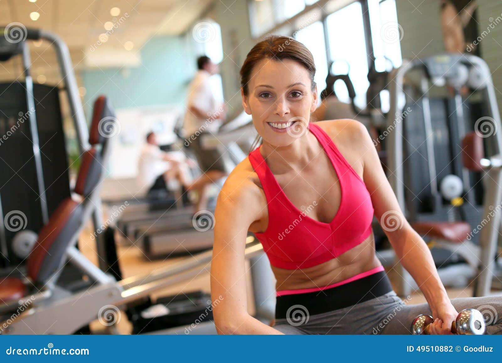 Portrait of a Happy Young Woman in a Fitness Club Excercising Stock ...