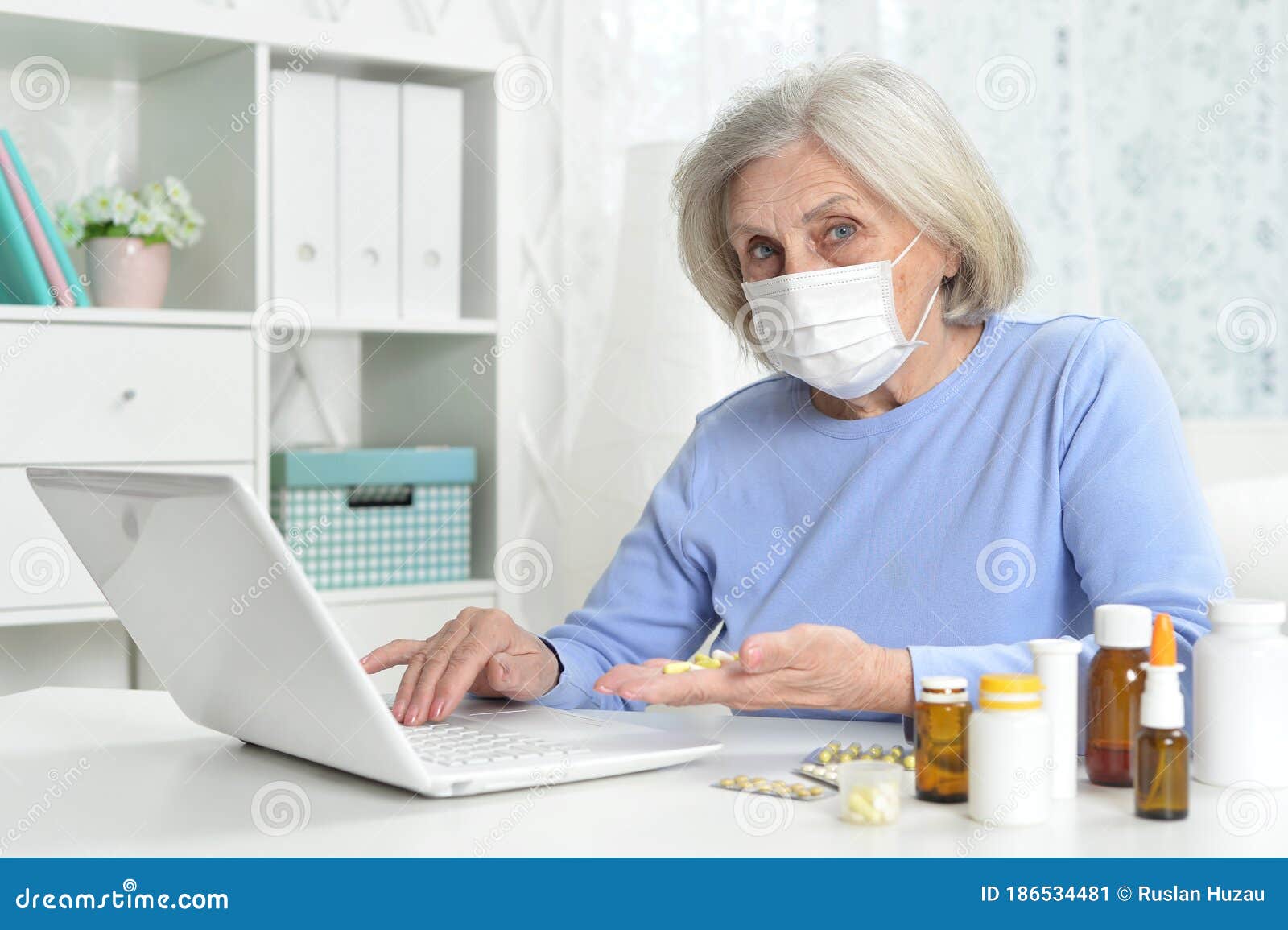 Ill Beautiful Senior Woman With Facial Mask Holding Pills Stock Image Image Of Person