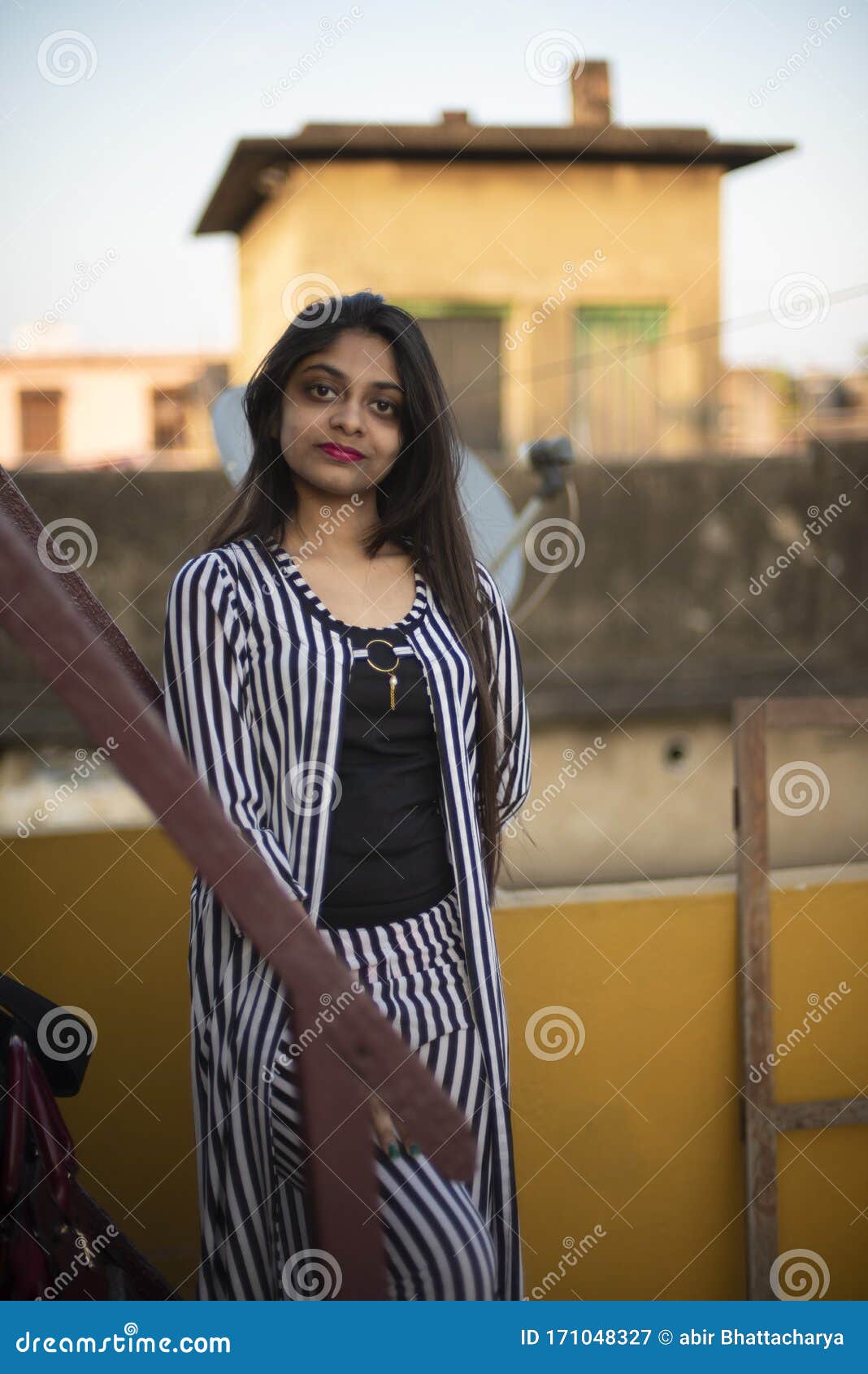 Portrait of Indian Bengali Brunette Girl in Striped Semi Formal Wear  Standing on a Rooftop Stock Image - Image of afternoon, city: 171048327