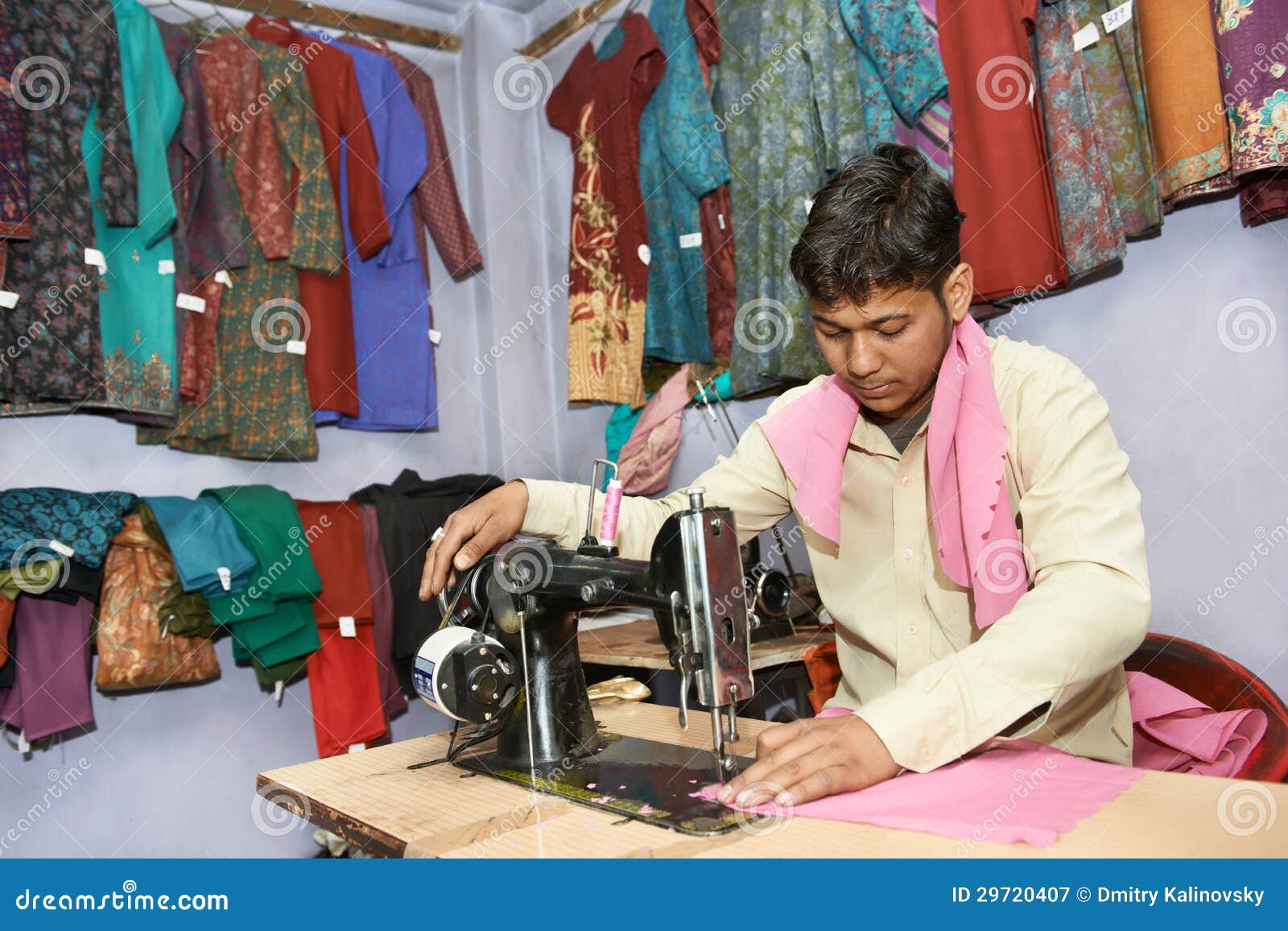 portrait-indian-man-tailor-work-place-sewing-machine-29720407.jpg