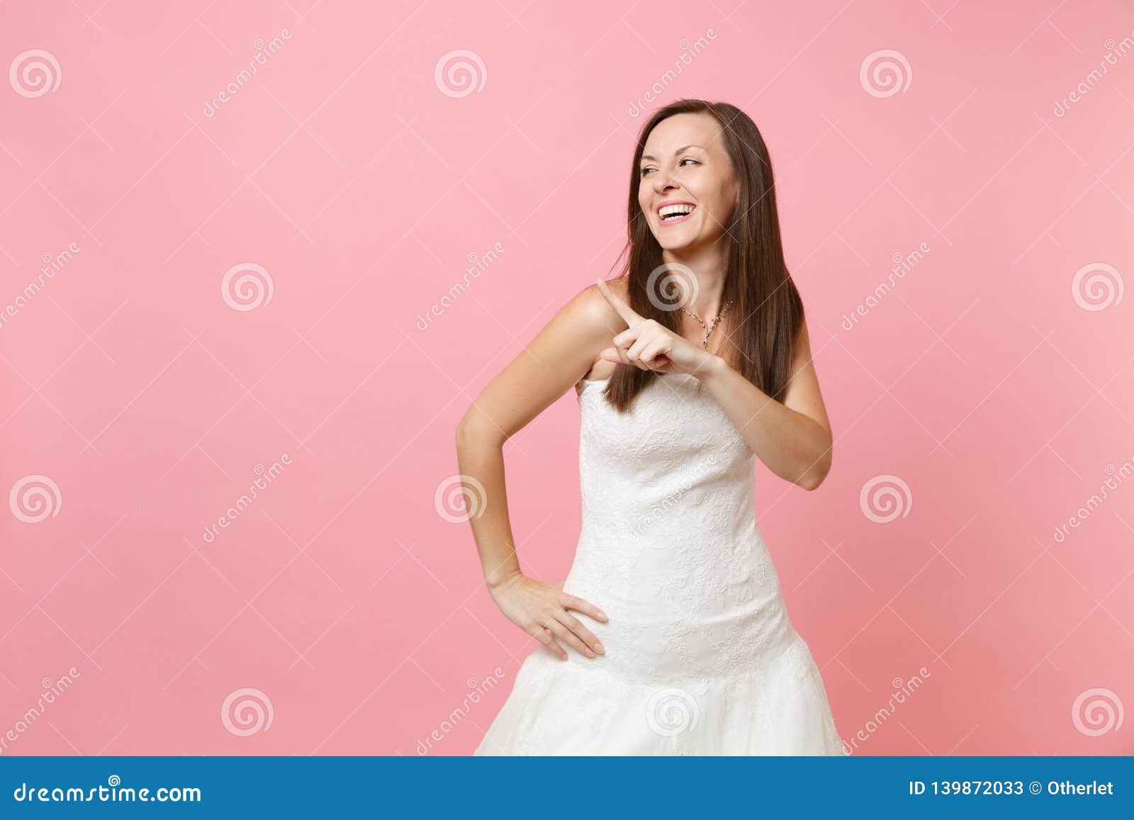 Portrait of Laughing Joyful Bride Woman in White Wedding Dress Stand ...