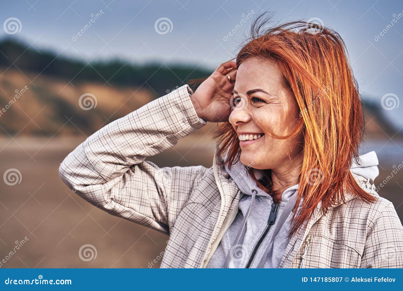 Portrait of a Laughing Middle-aged Woman with Red Hair Walking Along ...