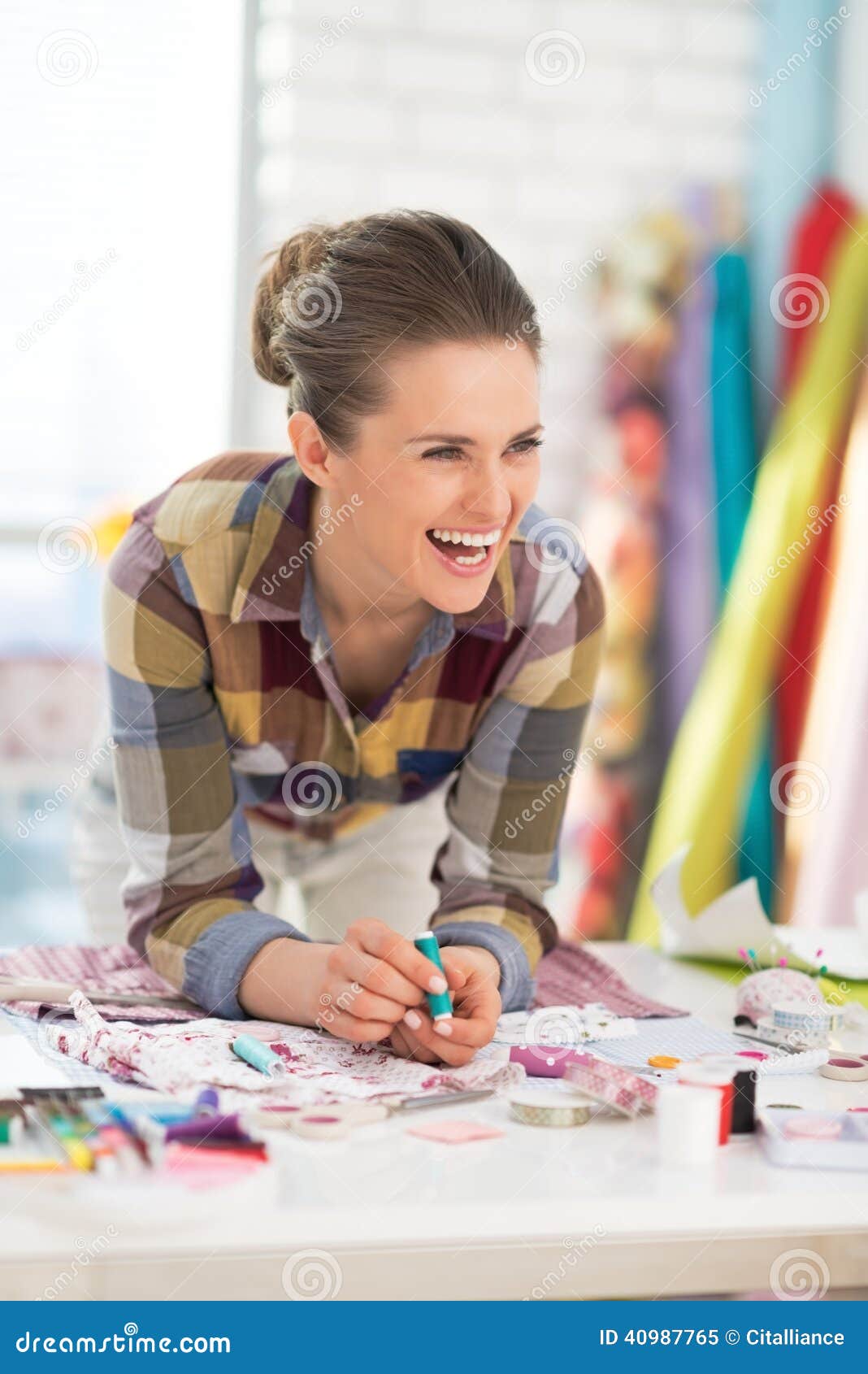 Portrait Of Seamstress Near Mannequin In Suit Stock Image