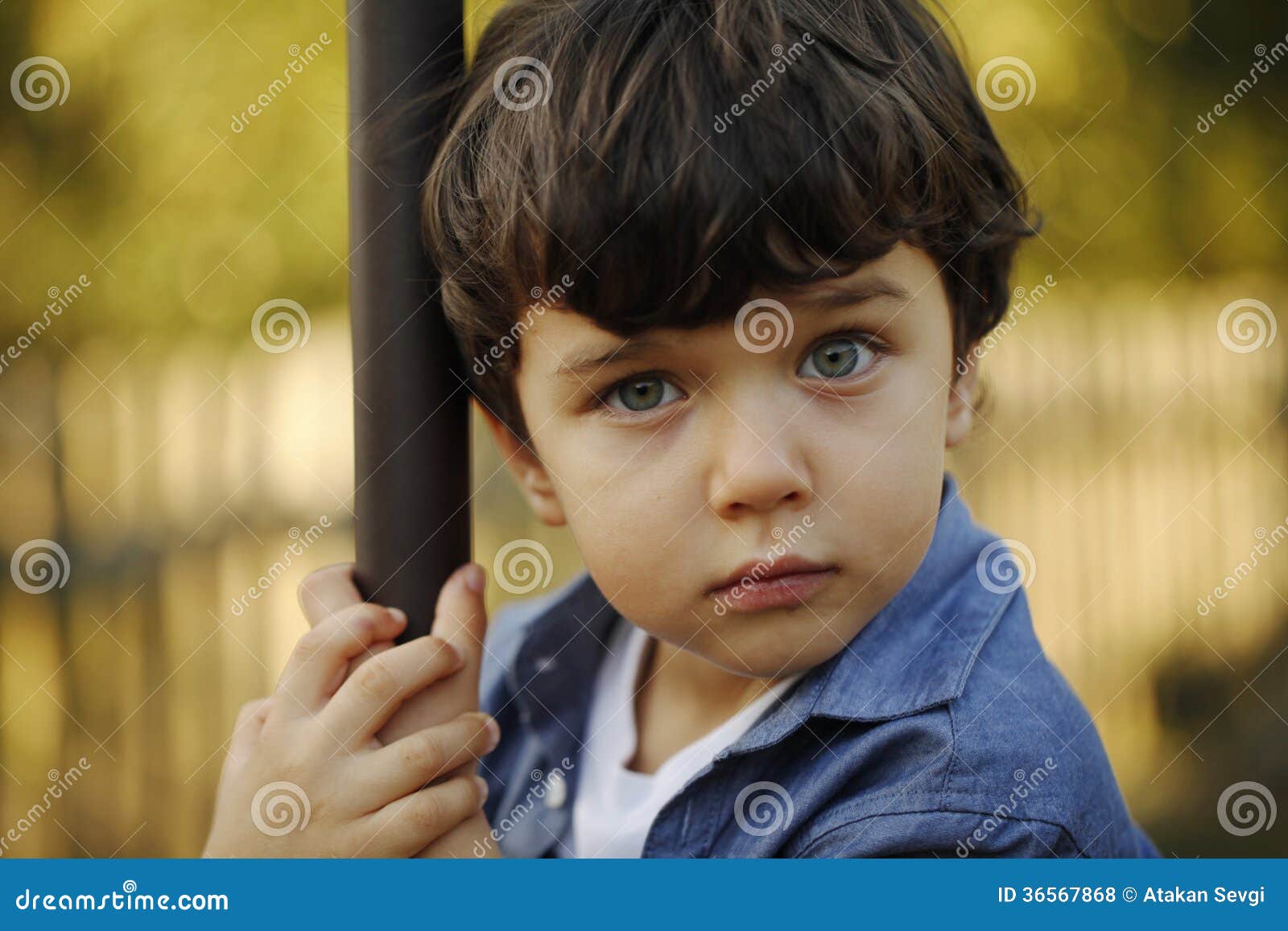 Portrait Of A Little Boy With Blue Eyes And Cute Face Stock