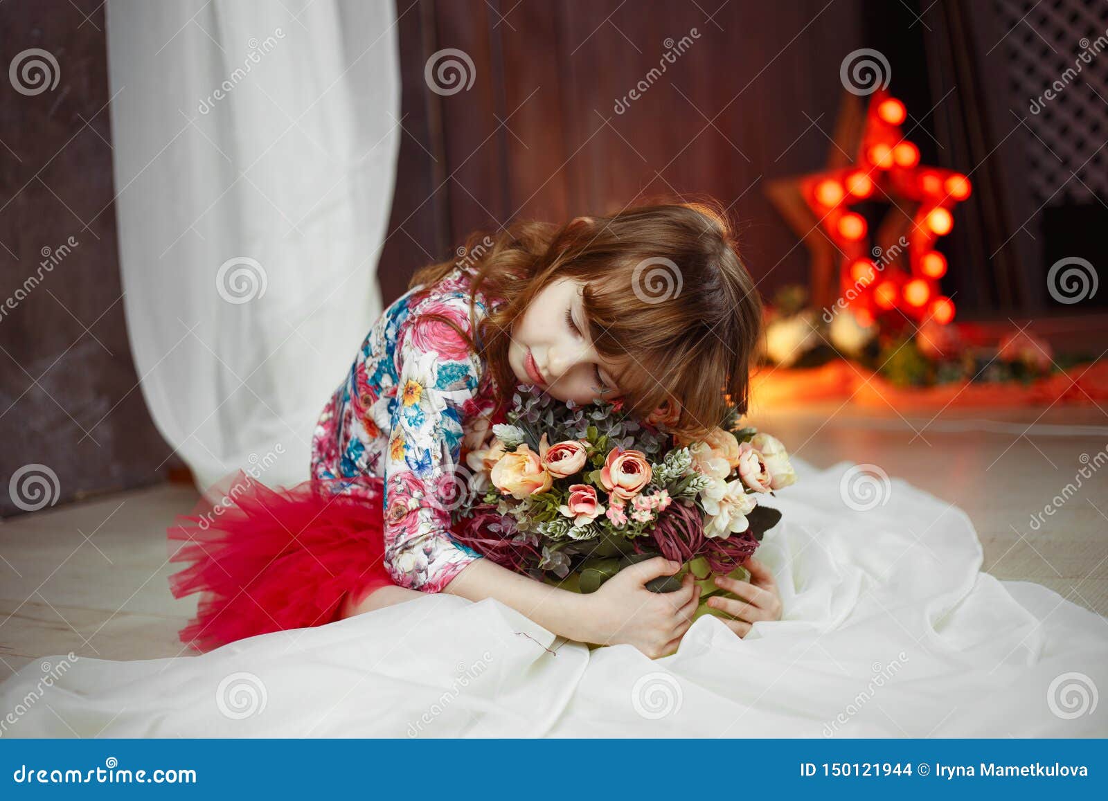 portrait of little girl  actress star with soffits on background