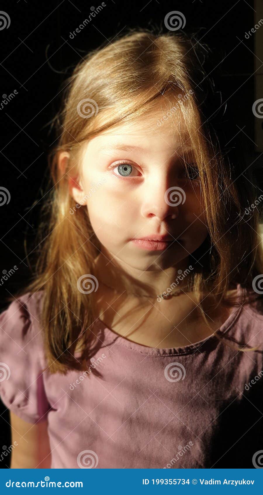 Portrait of a Little Girl with Golden Hair and Blue Eyes, the Child Looks  at the Camera with Big Eyes Stock Photo - Image of beauty, model: 199355734