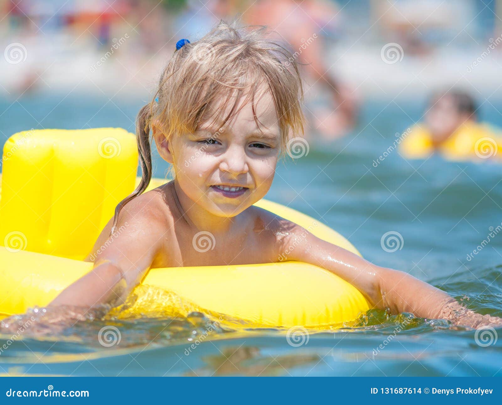 Little girl in sea stock photo. Image of adorable, cheerful - 131687614