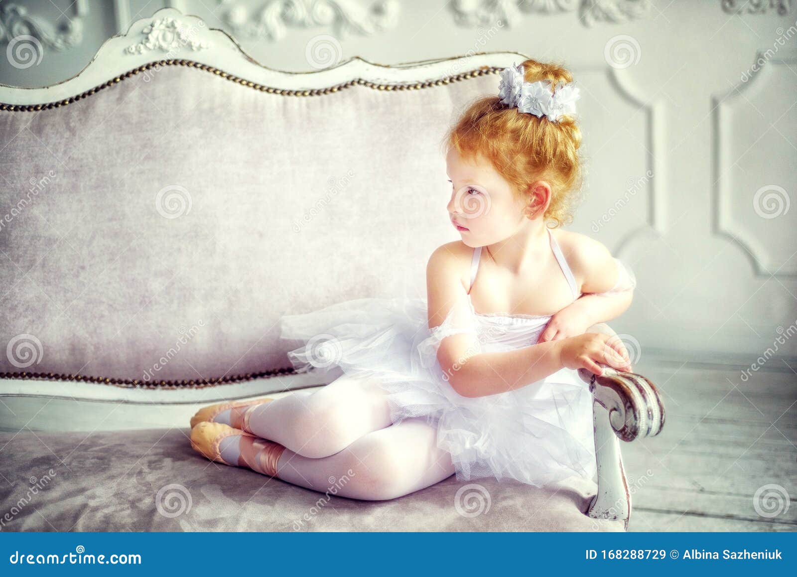 Portrait Little Years Old Blonde Curly Ballerina Sitting in Light Room on Sofa in Ballet Dress White Tutu Pointes. Stock Image - Image of ballerina, ballet: 168288729