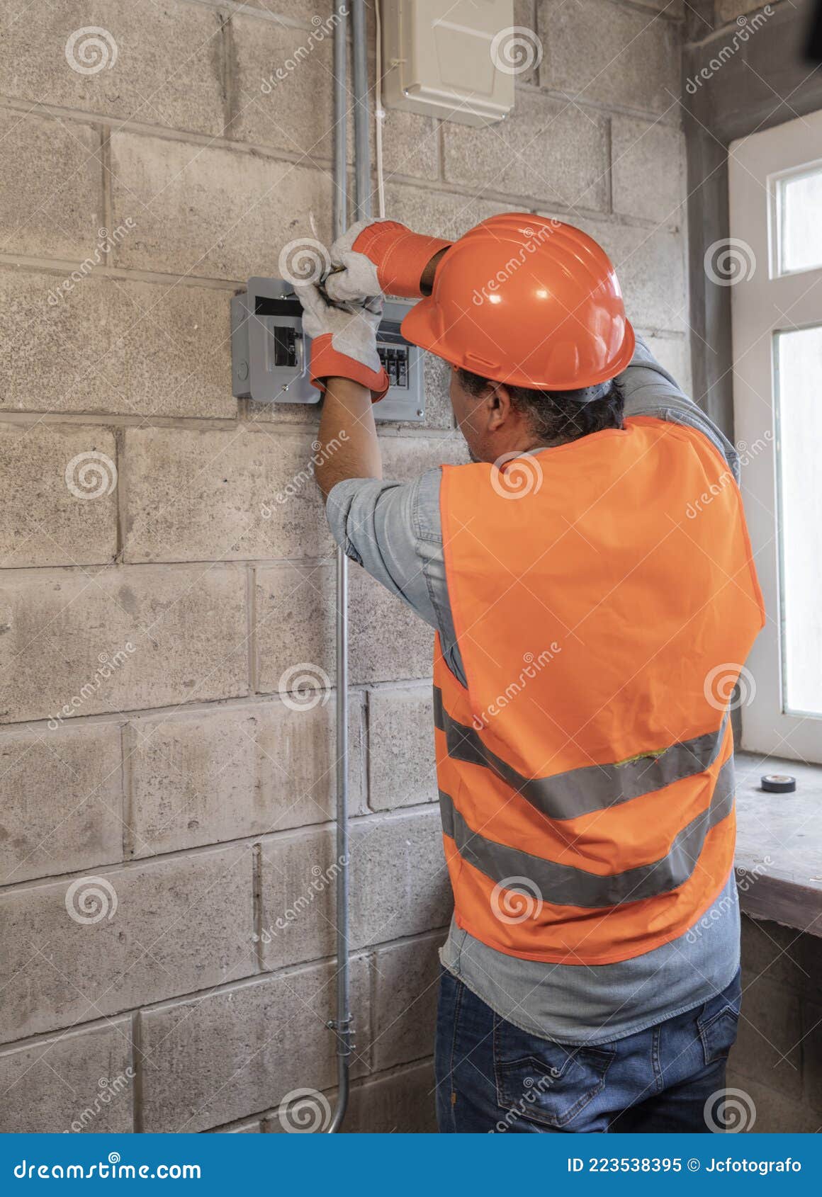 portrait of male electrician in a factory