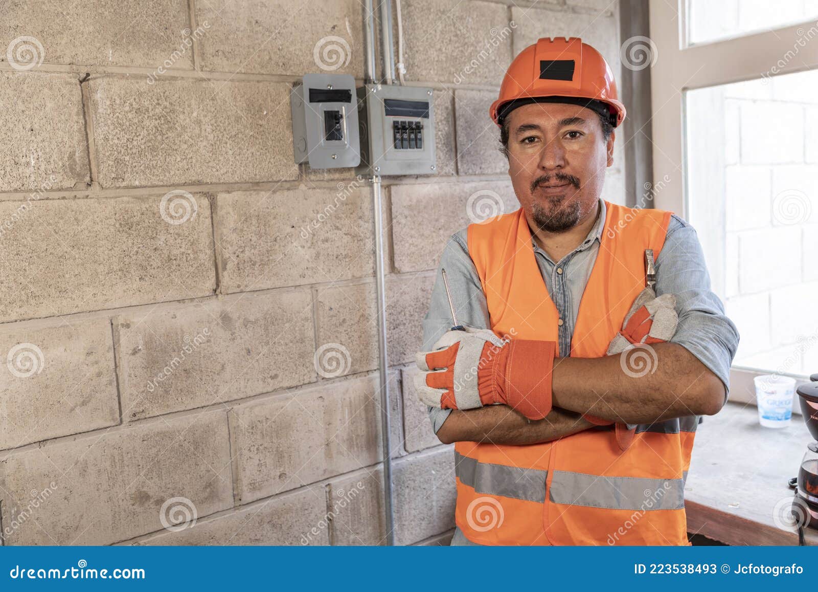 portrait of male electrician in a factory