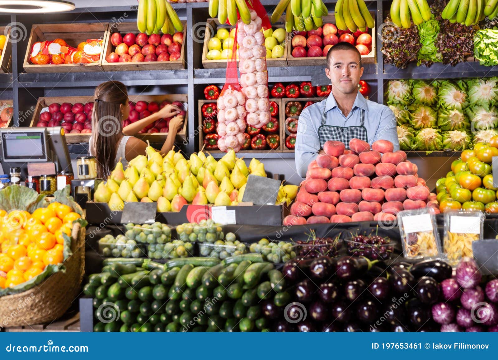 shop assistants working in fruit and vegetable shop