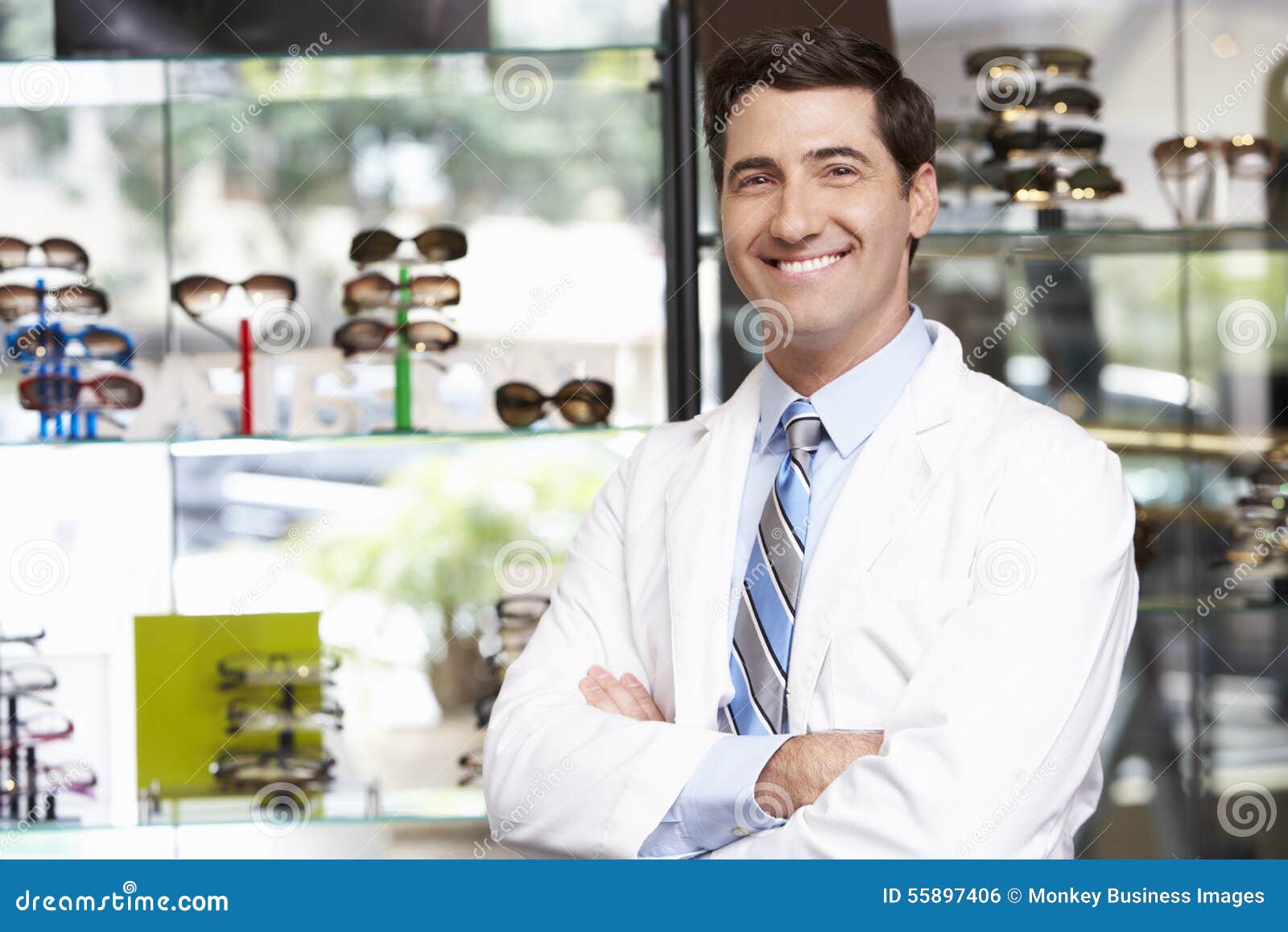 portrait of male optician by glasses display