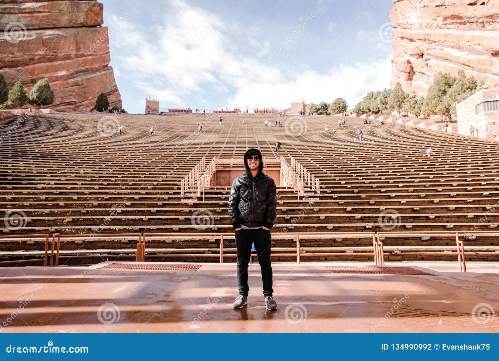 Portrait of Male Person Standing Front and Center on a Stage Dreaming