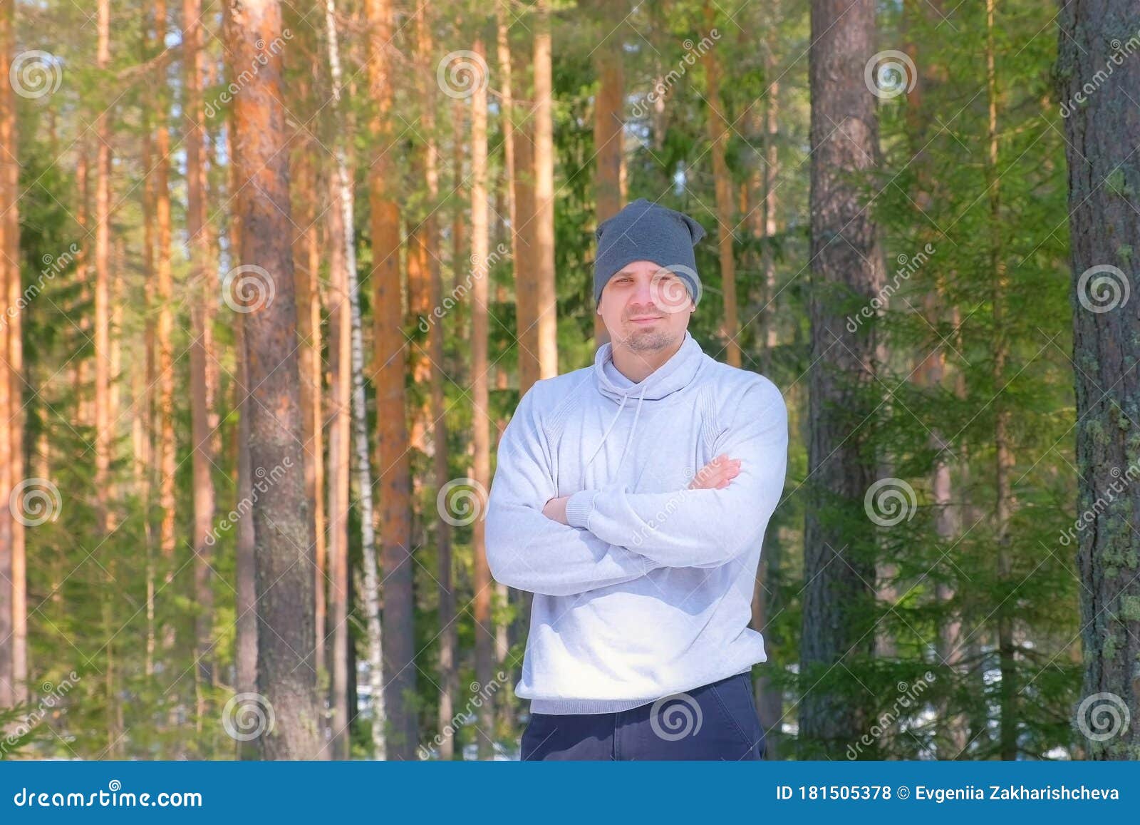 Portrait of Man in Cap in Pine Forest Standing and Looking at Camera ...