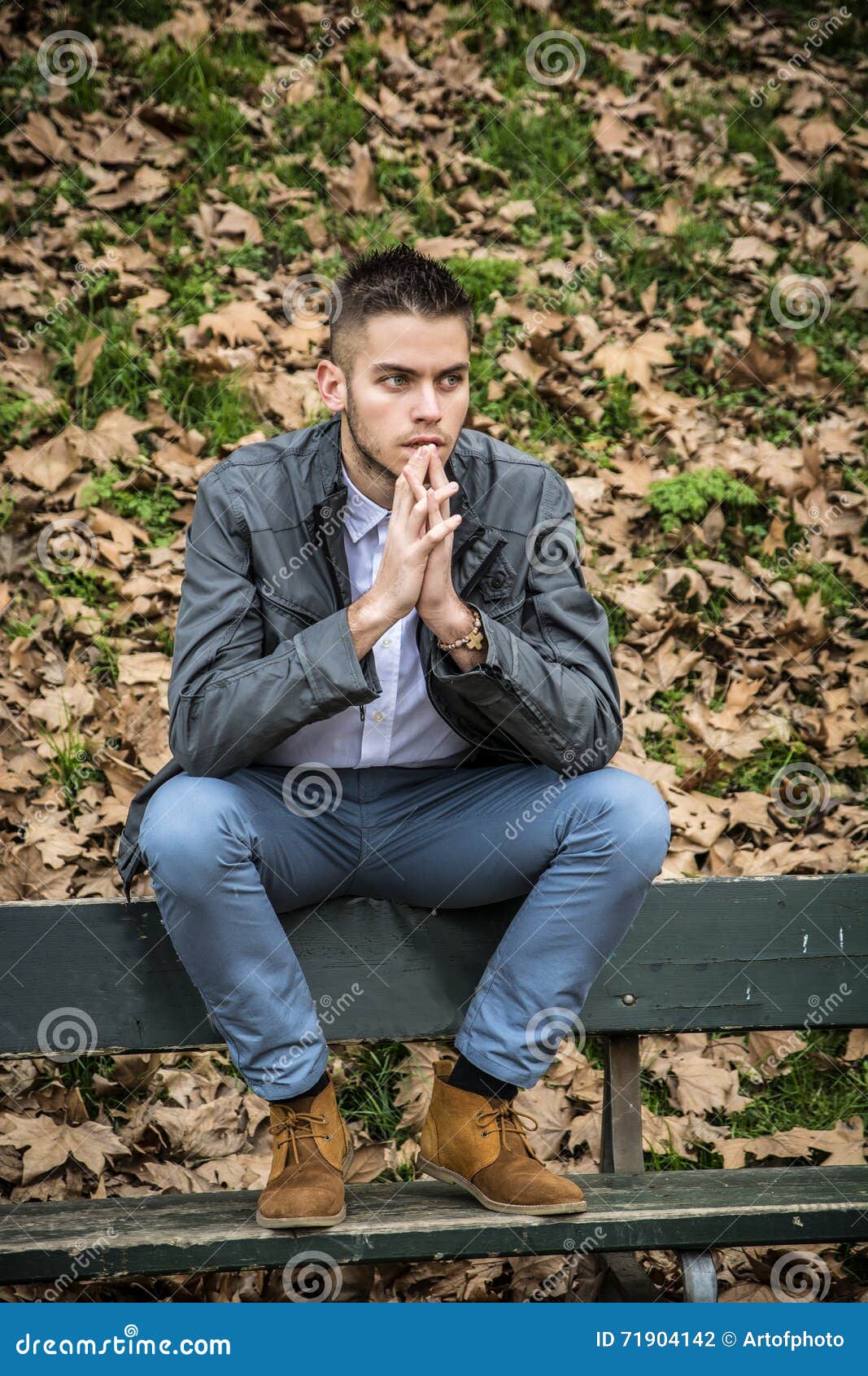 Portrait Of Man Sitting In Park Stock Photo - Image: 71904142