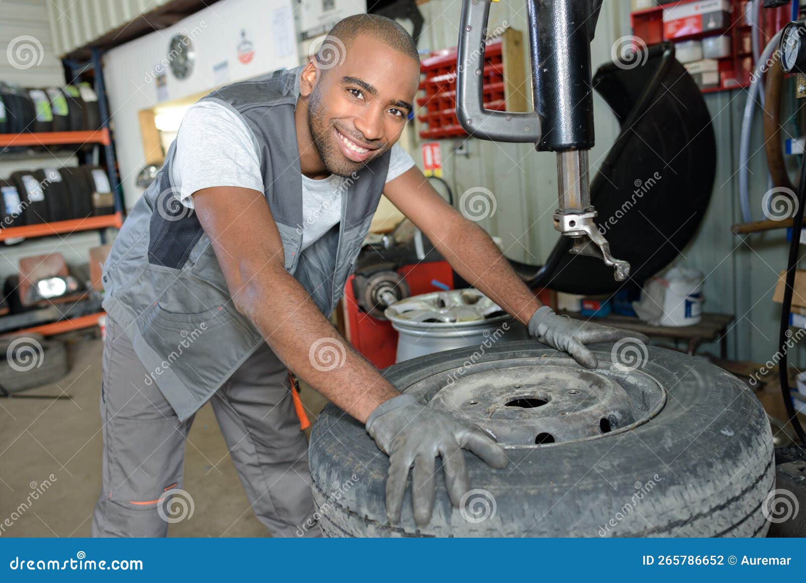 portrait man vulcanizing shop worker