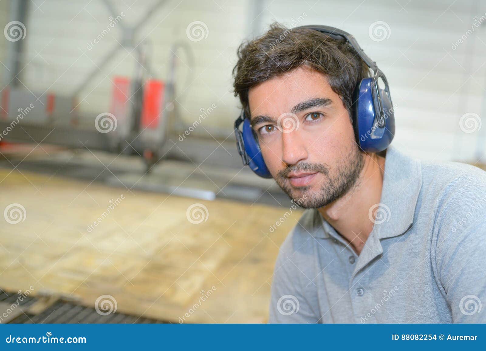 Portrait Man Wearing Earmuffs Stock Photo Image of indoors, scruffy