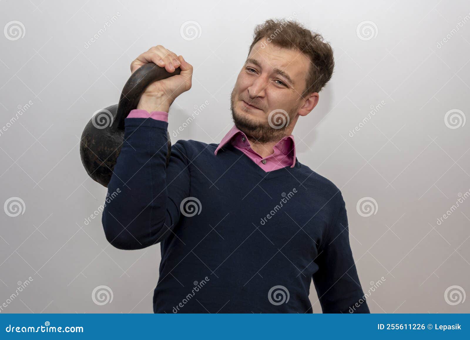 Portrait of a Man 3538 Years Old, Lifting a Heavy Weight on a Light