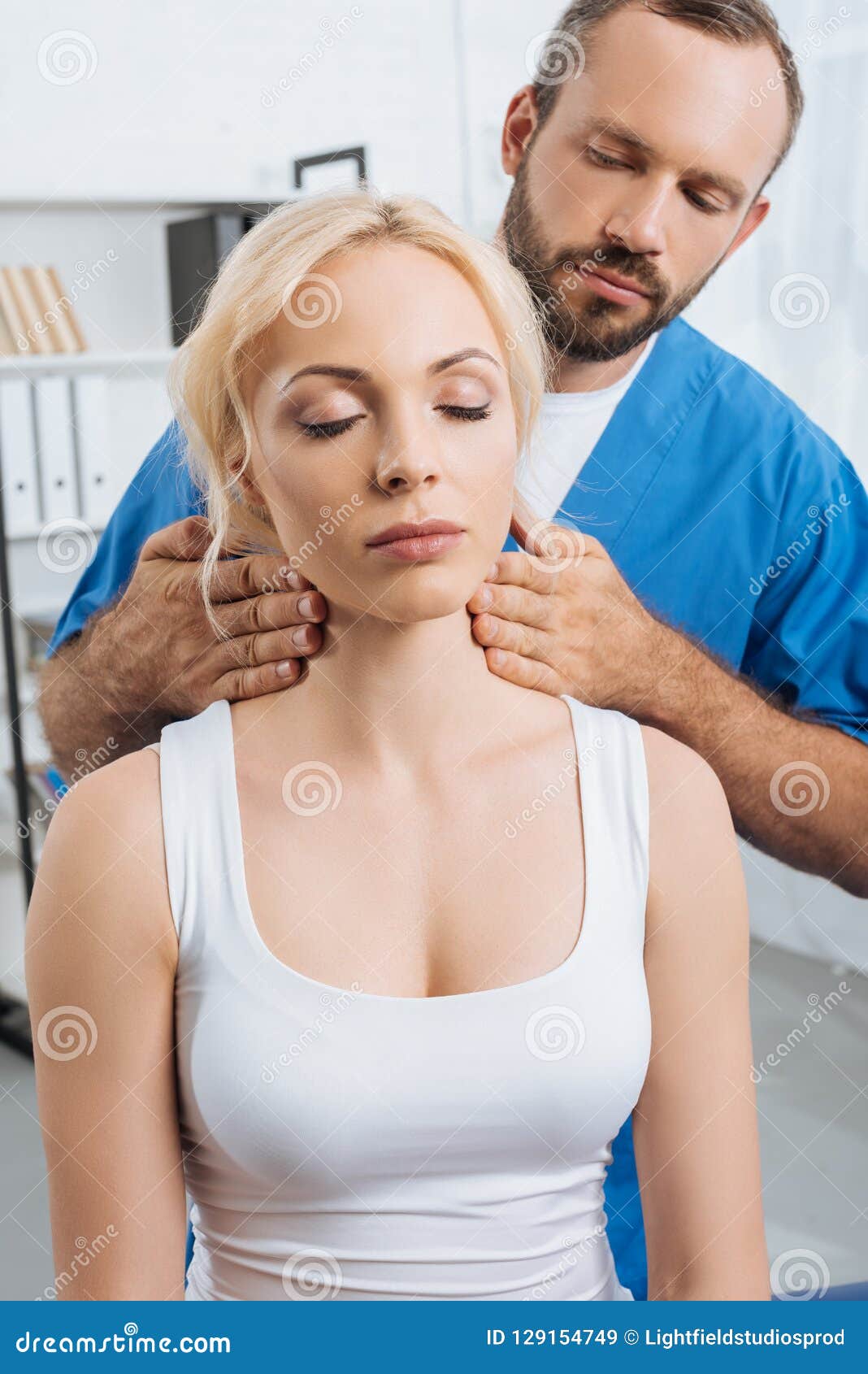 Portrait Of Massage Therapist Massaging Neck Of Young Woman Stock Image Image Of Healthcare