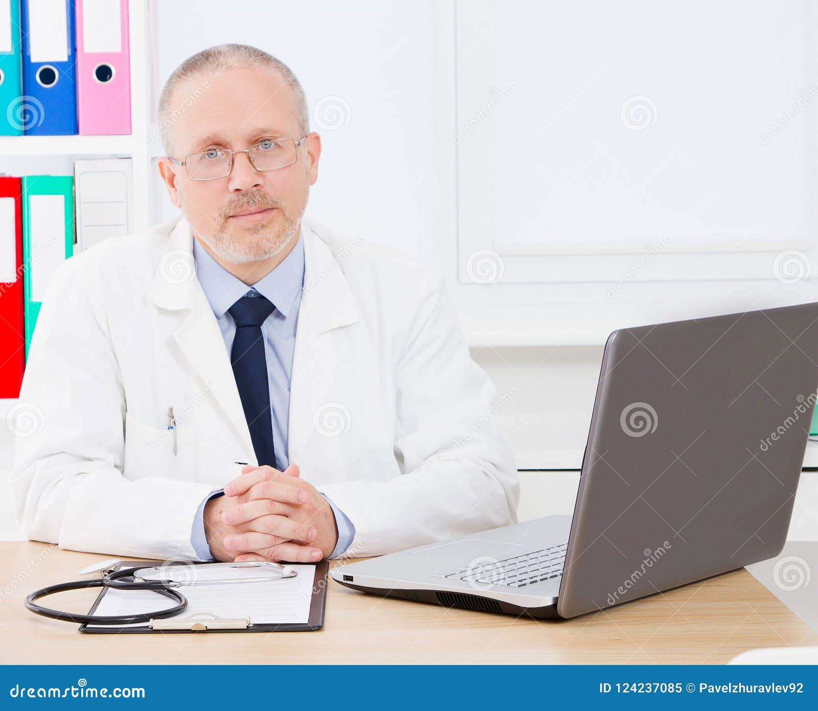 Portrait of Mature, Doctor Sitting in Medical Office Stock Image ...