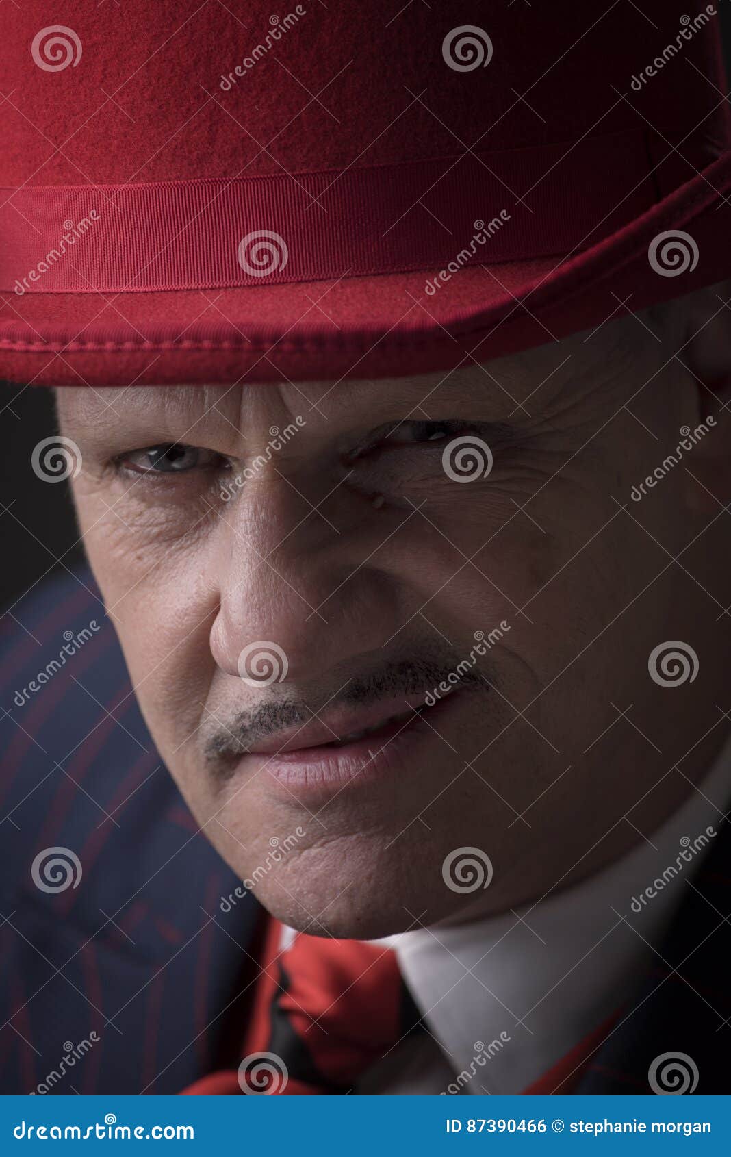 Portrait of a mature gangster on a black background