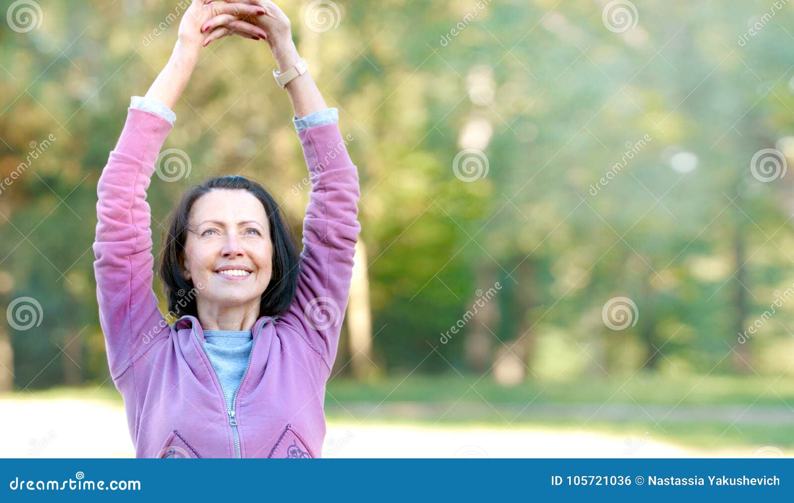 portrait of mature woman before or after jog in the park