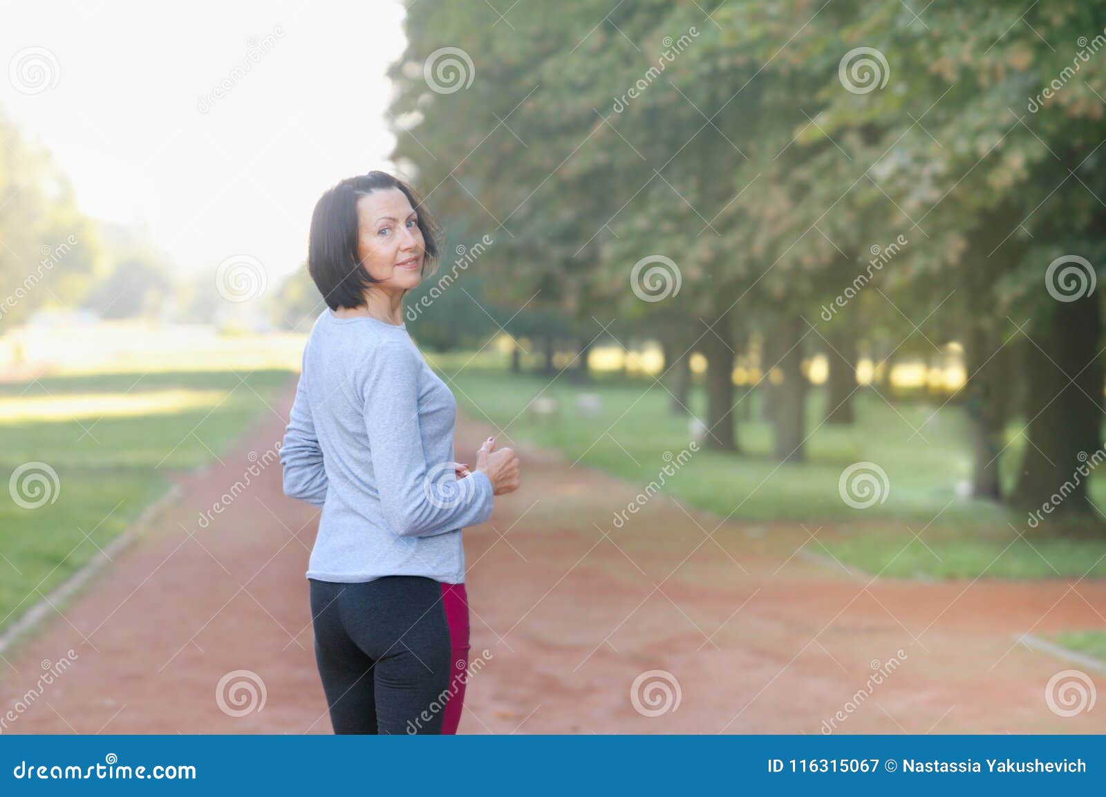 portrait of mature woman before or after jog in the park