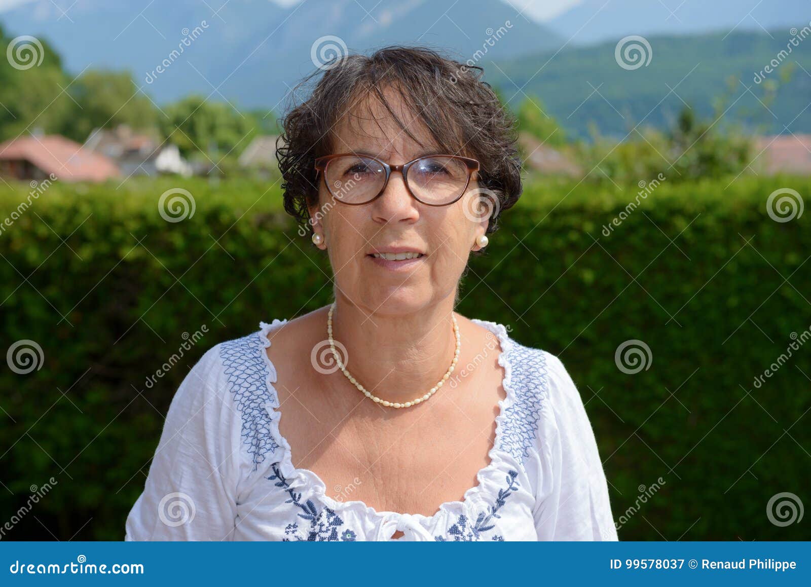 Portrait Of A Middle Aged Brunette Woman With Eyeglasses Outdoor Stock