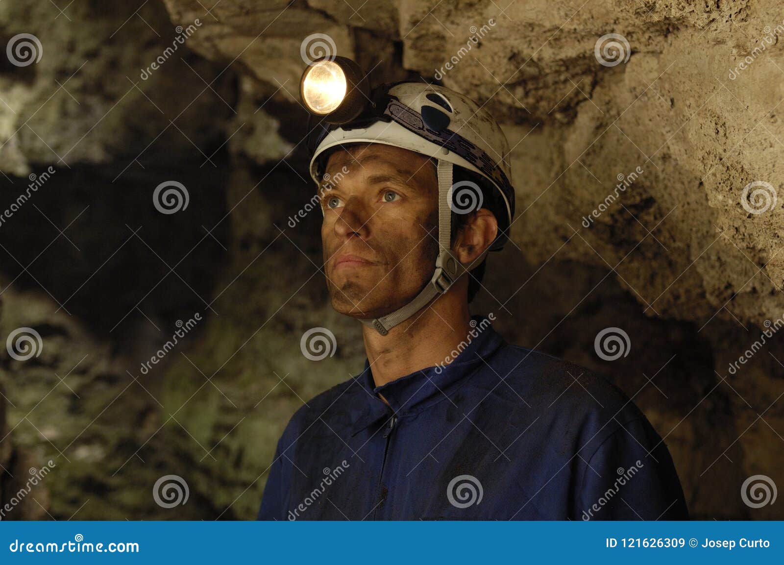 portrait of a miner inside a mine