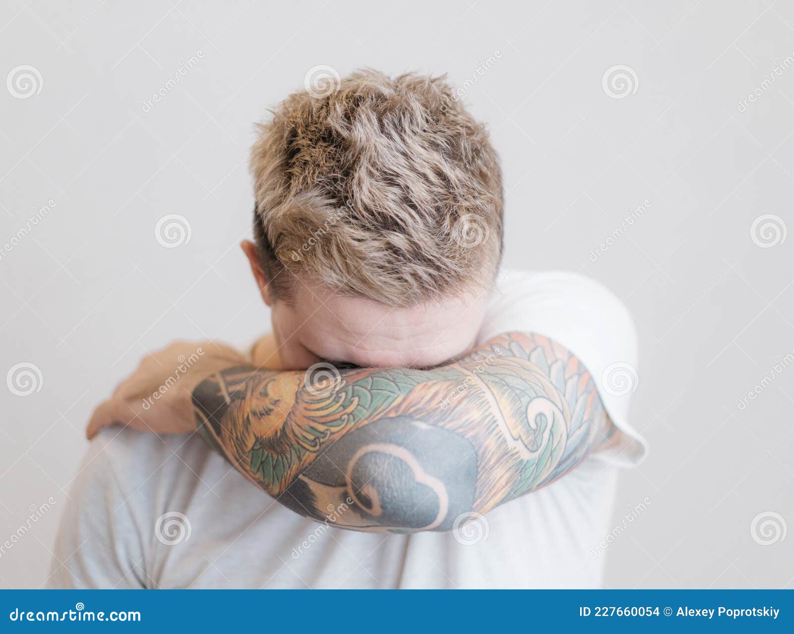 portrait modern young guy tattoo his arm portrait modern young guy tattoo his arm man covers 227660054