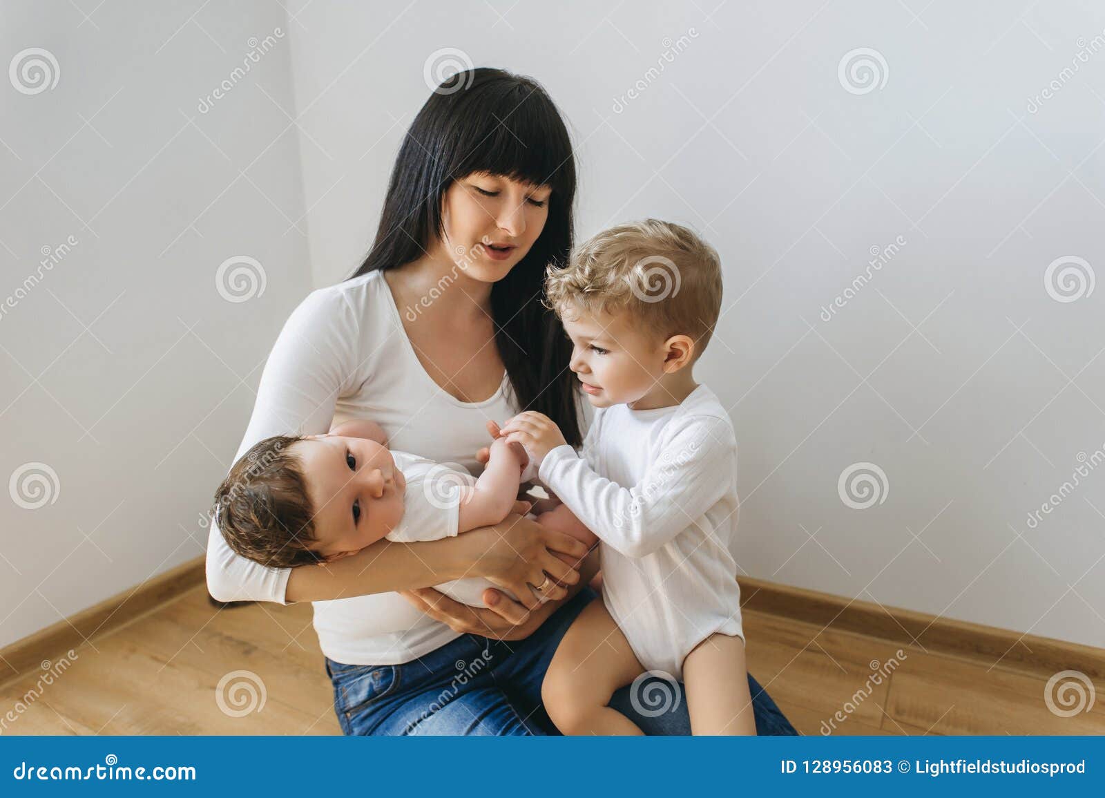 Portrait Of Mother With Two Little Sons On Hands Stock Image Image Of