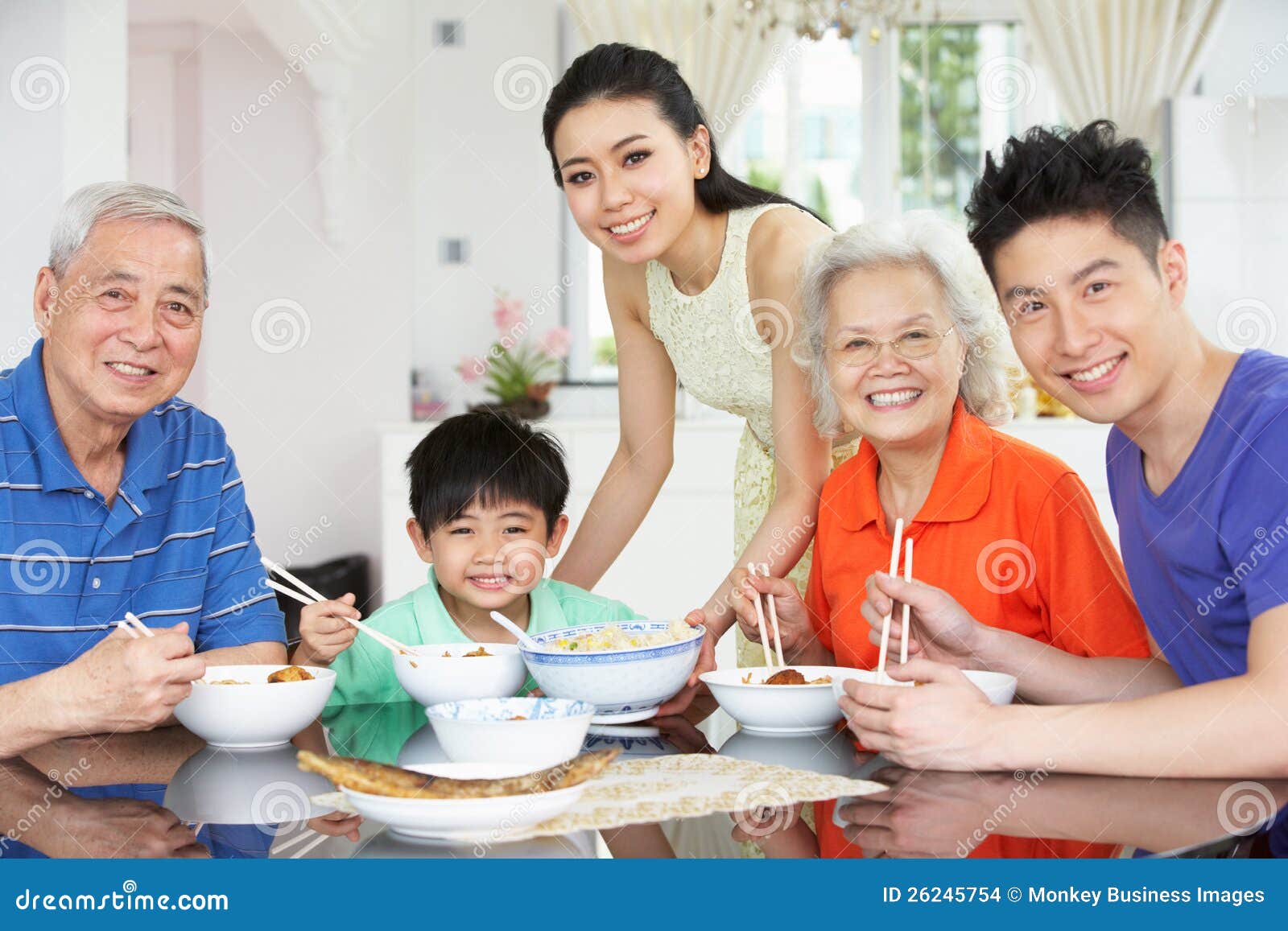 Portrait Of Multi-Generation Chinese Family Eating Stock Images 