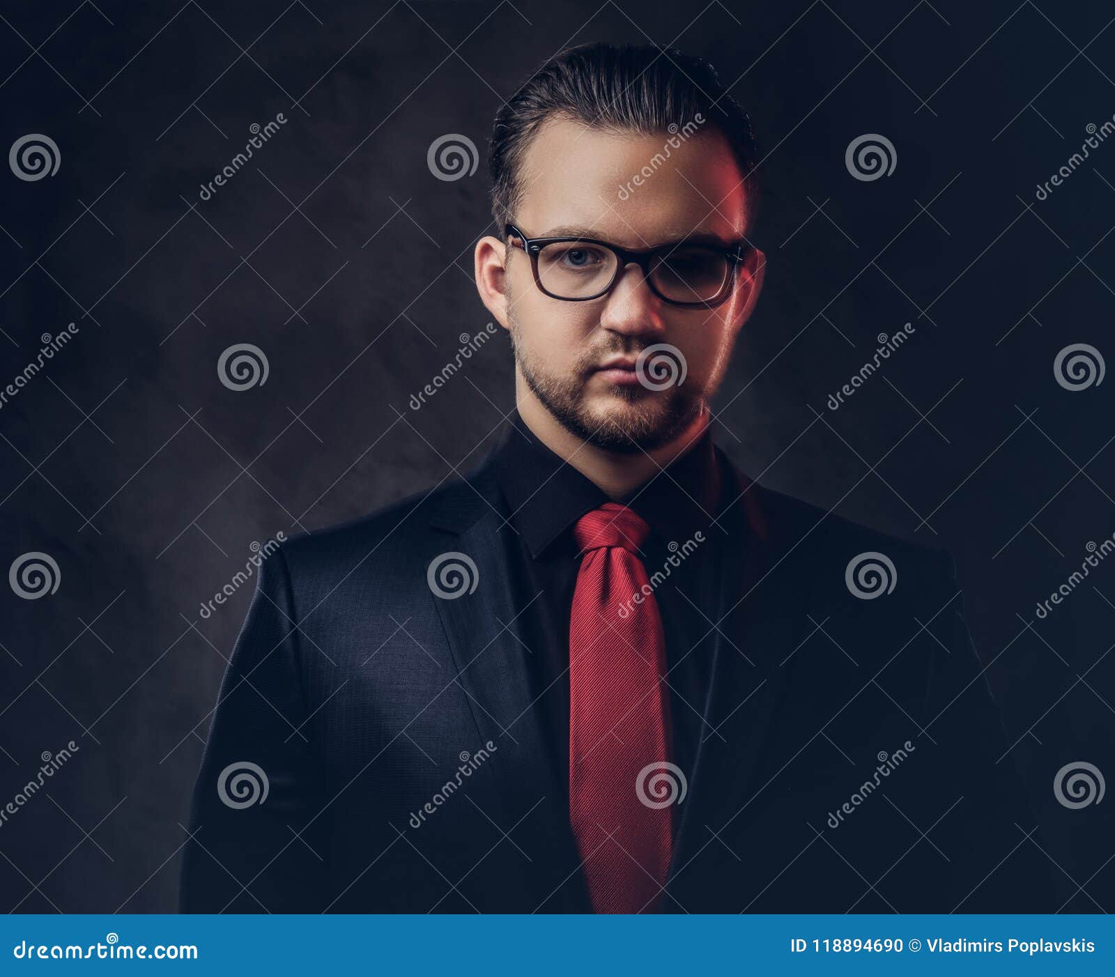 Portrait of a Mystical Stylish Male in a Black Suit and Red Tie ...