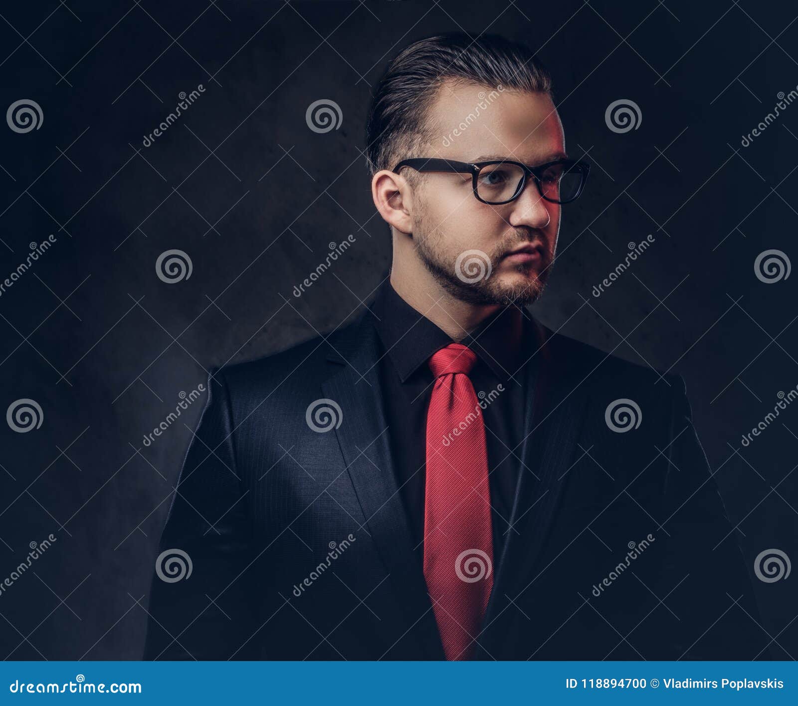 Portrait of a Mystical Stylish Male in a Black Suit and Red Tie ...