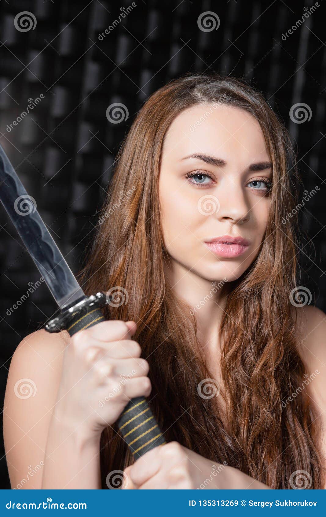 Portrait Of A Naked Woman With A Katana In Her Hands Stock Image