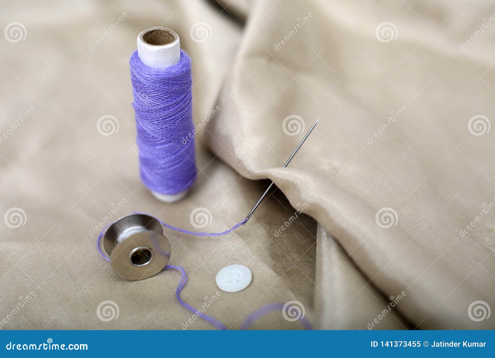 Portrait of Needle Attached in Cloth with Purple Sewing Thread and