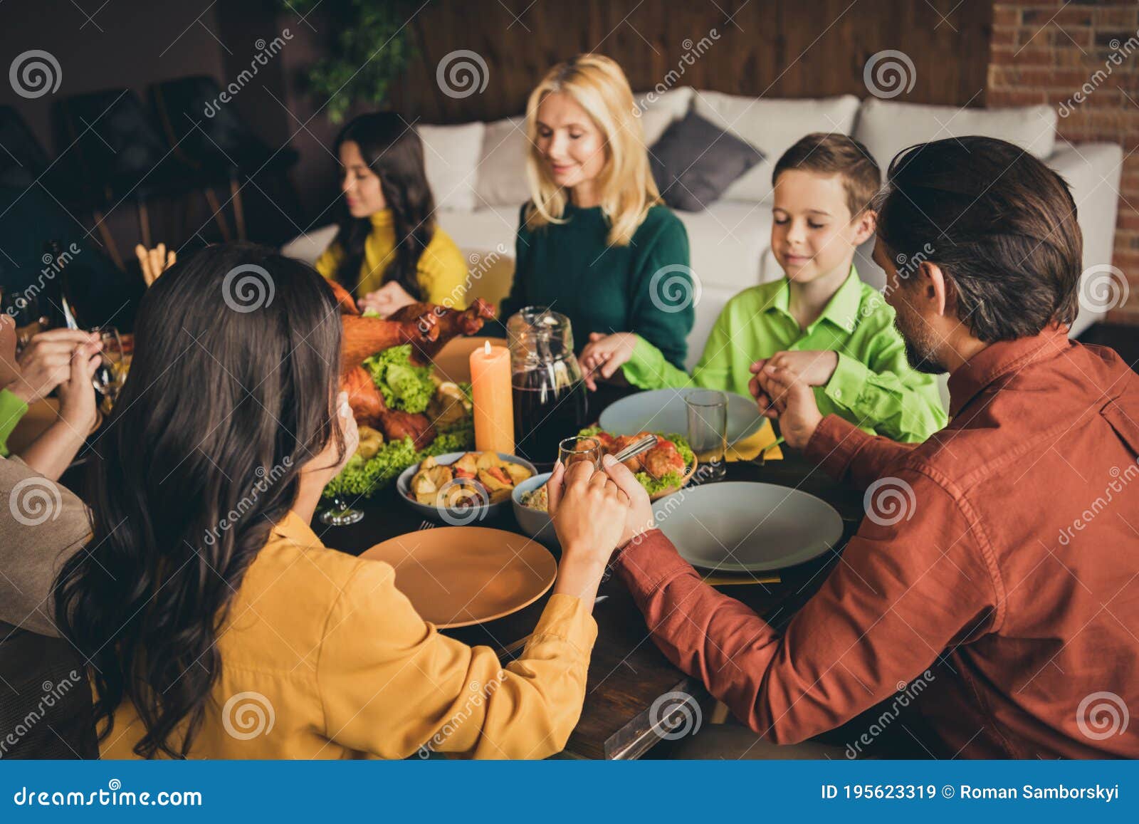 Portrait of Nice Attractive Peaceful Multi Generation Family Sitting