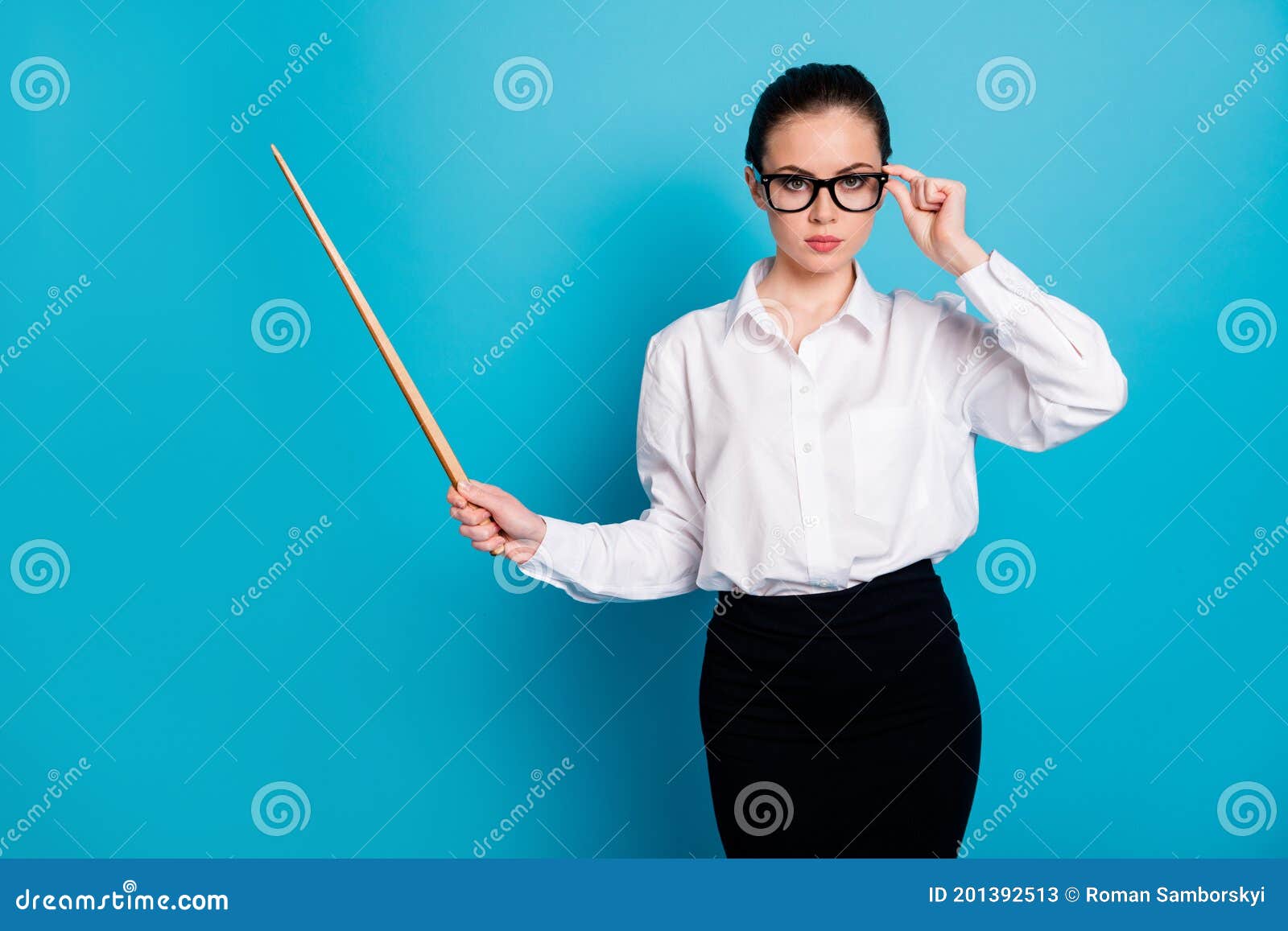 portrait-nice-attractive-smart-stylish-teacher-pointing-wooden-stick-isolated-over-bright-blue-color-background-201392513.jpg